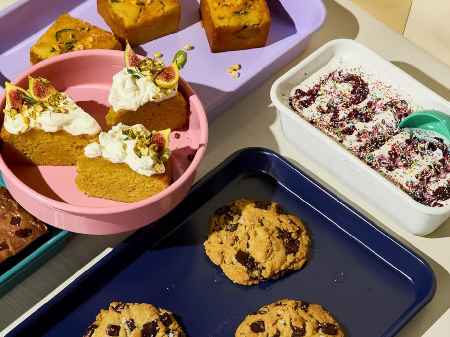 so yummy bakeware with cookies, cakes and pies on them.