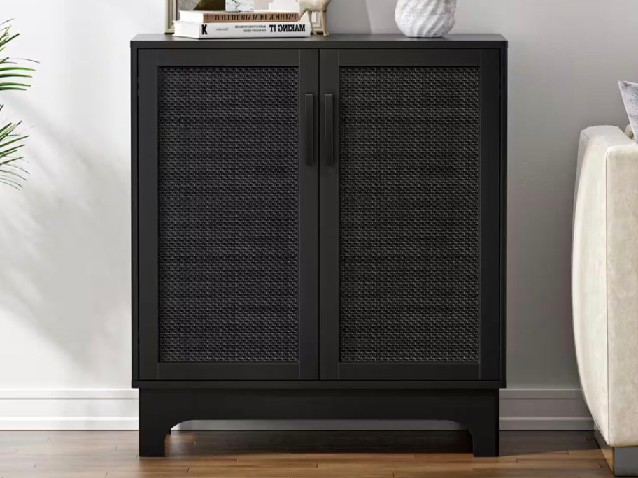 black sideboard table with rattan doors 