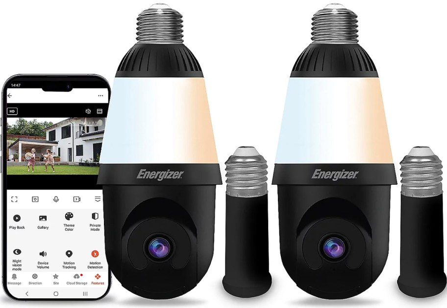 two black smart bulbs next to extenders and phone 