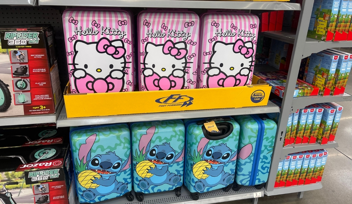 hello kitty and stitch kids spinner luggage on a store shelf