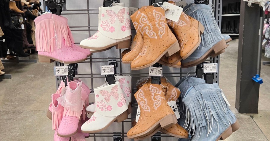 pink, white, brown, and blue boots hanging on display 