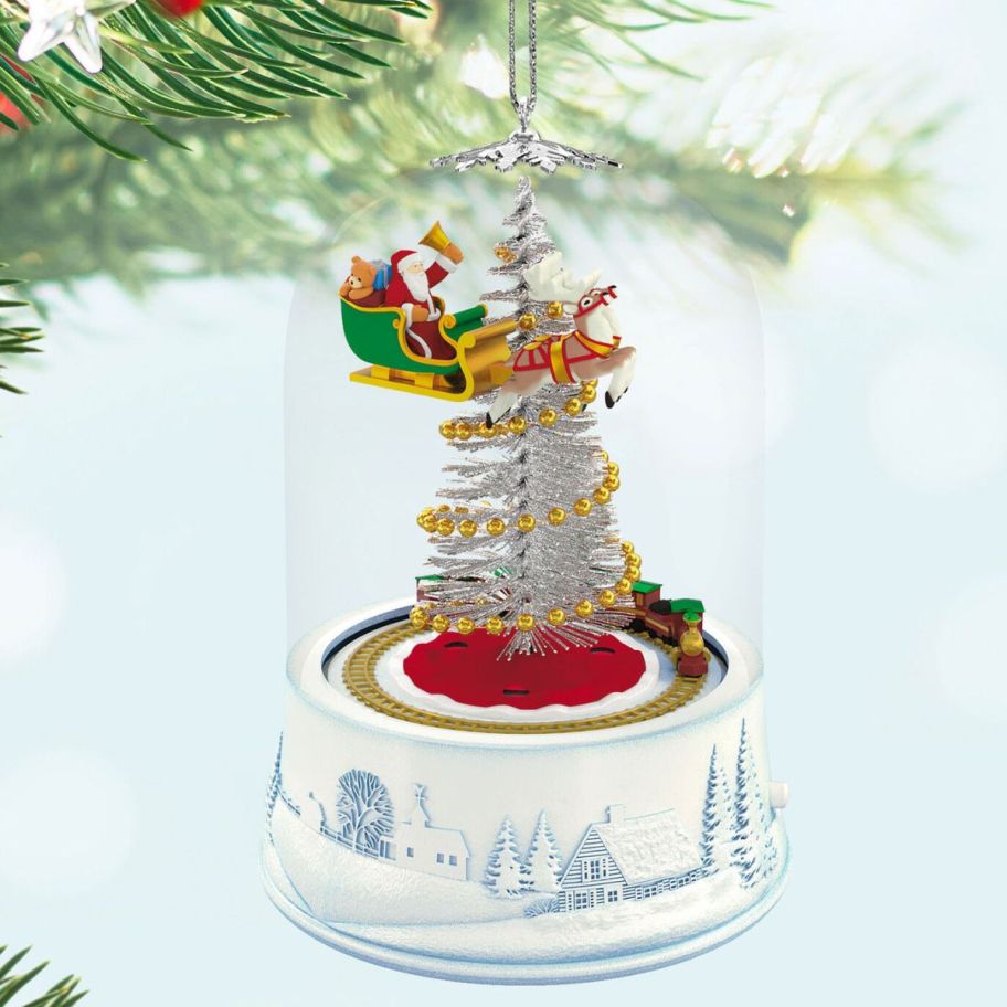 stock image of And To All a Good Night! Musical Ornament w Light & Motion dangling on tree