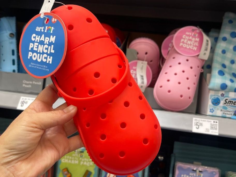 Hand holding a red Art 101 Pencil Case with holes for Jibbitz Charms