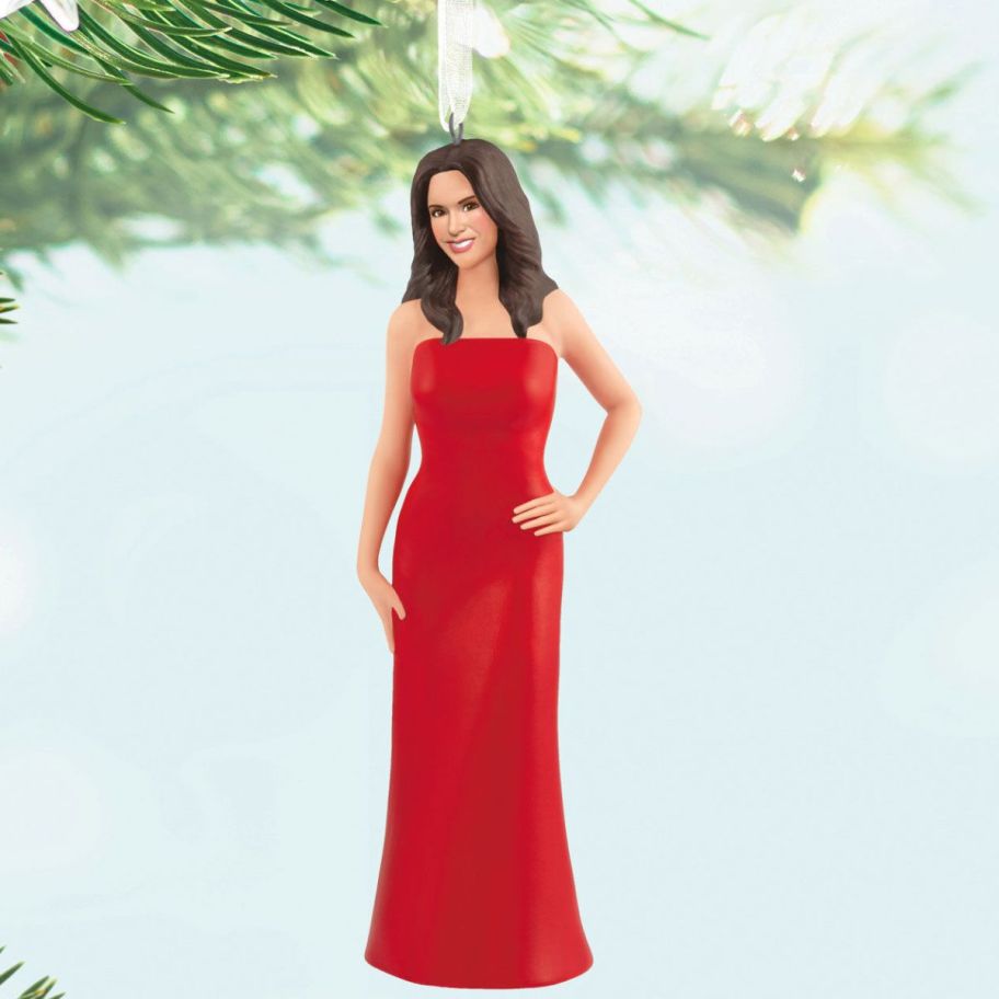 stock image of Hallmark Lacey Chabert Porcelain Ornament dangling on a christmas tree