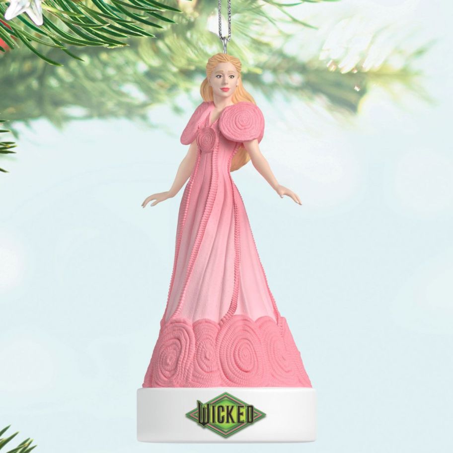 stock image of Hallmark Wicked Popular Musical Ornament dangling from a tree