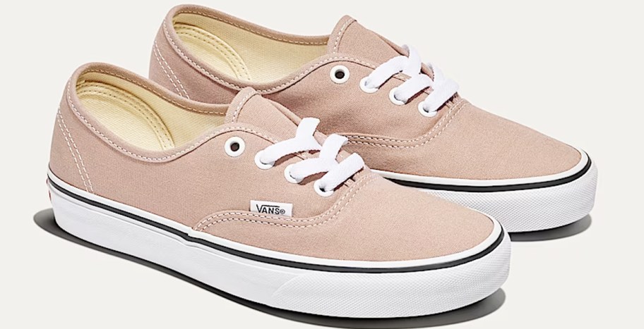 pair of light brown vans sneakers