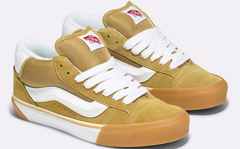 pair of yellow and white vans sneakers