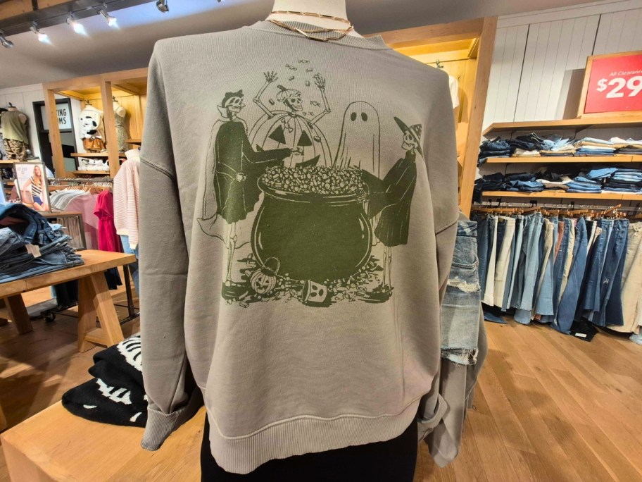 women's Halloween sweatshirt on a mannequin in a store