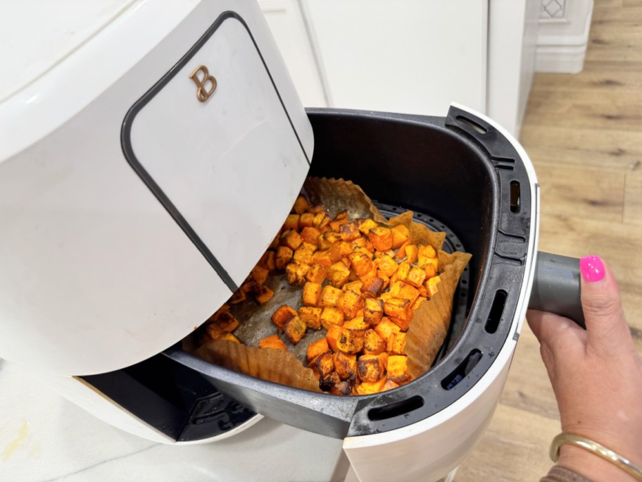 beautiful brand air fryer with air fryer liner and sweet potatoes