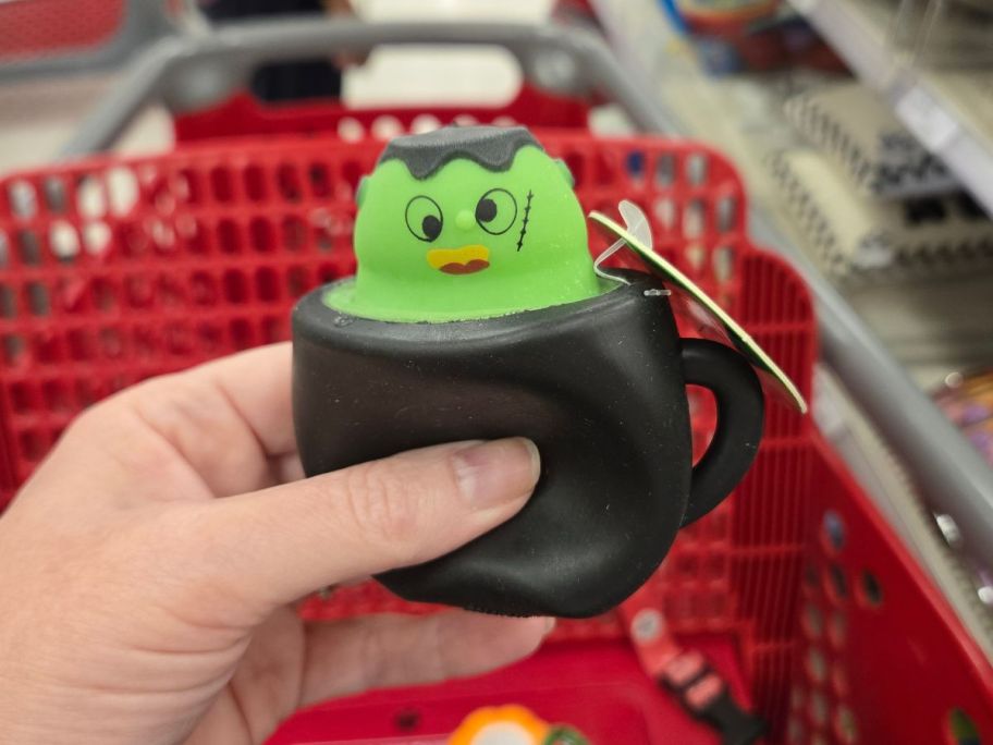 black and green Halloween Squishy in hand in store