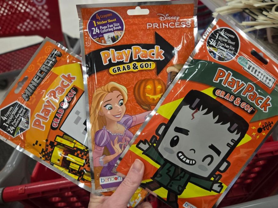 three Halloween PlayPacks in hand in store