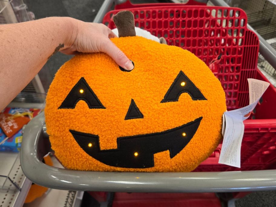 pumpkin plush in hand in store