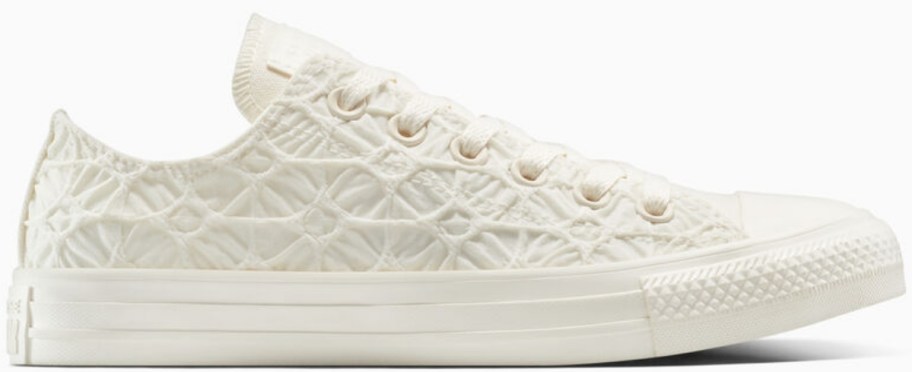 a white textured lace up sneaker