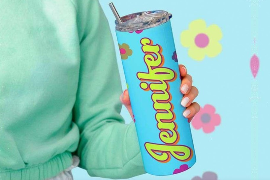 hand holding blue water bottle with name Jennifer