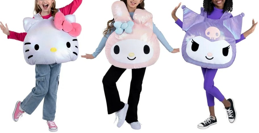 three girls wearing hello kitty plush costumes