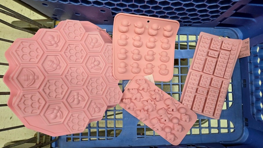 4 different silicone baking molds in blue cart