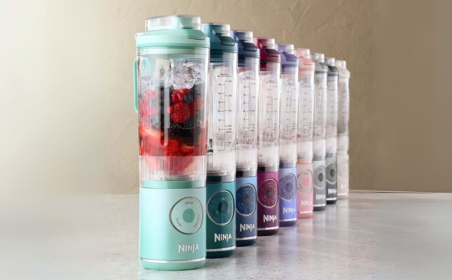 a row of portable blenders in various colors