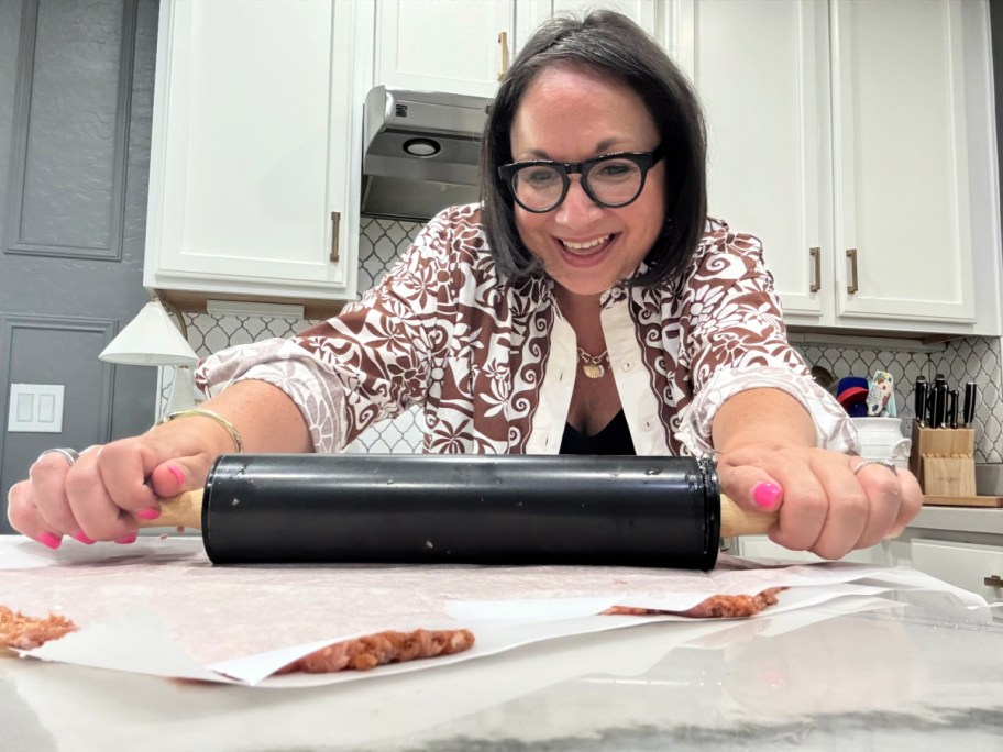 rolling ground beef thinly between parchment paper 