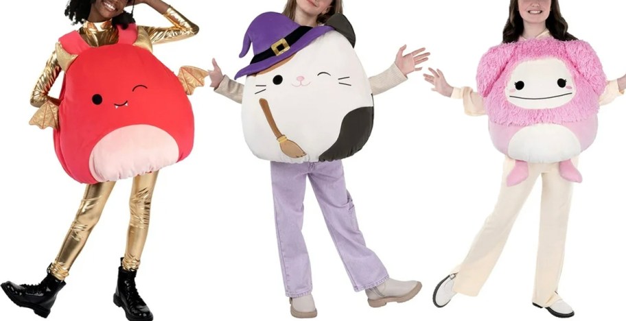 three girls wearing squismallows plush costumes 