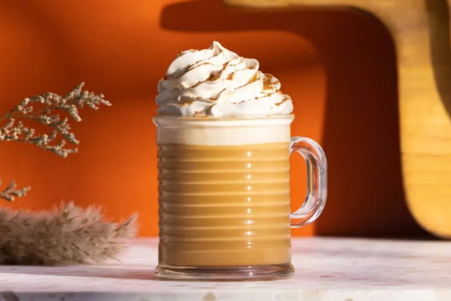 pumpkin coffee with whipped cream in mug