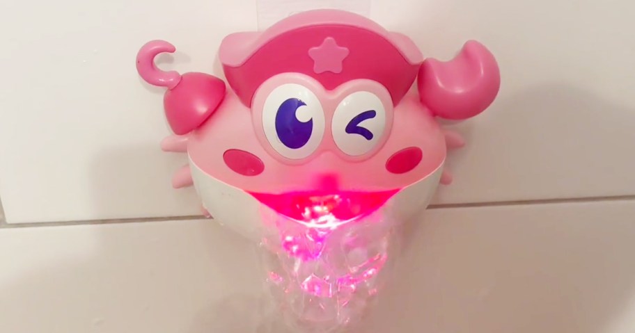 pink crab bubble maker displayed on the side of the bath tub