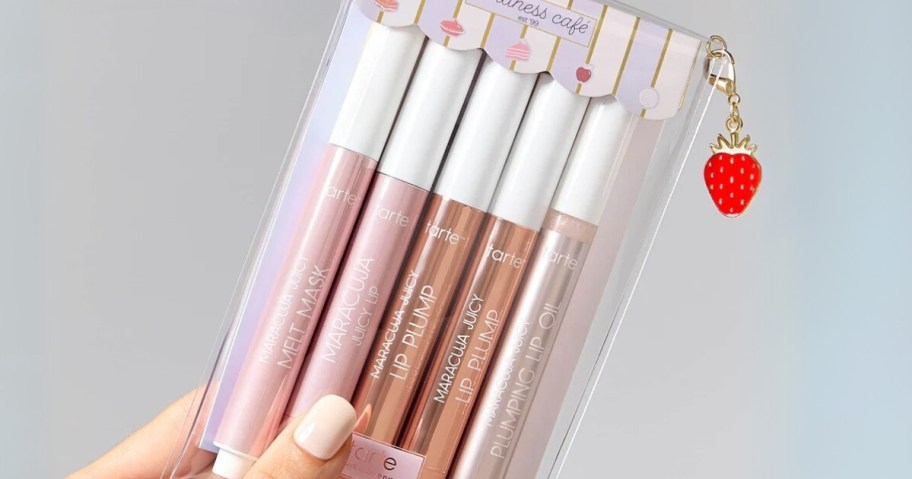 hand holding a tarte Maracuja lips set
