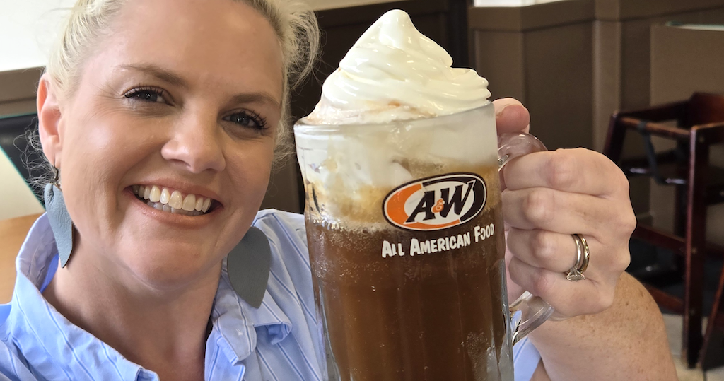 holding root beer float 