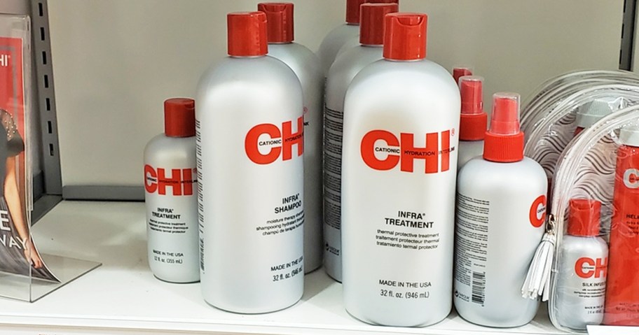 silver and red bottles of chi haircare on store shelf