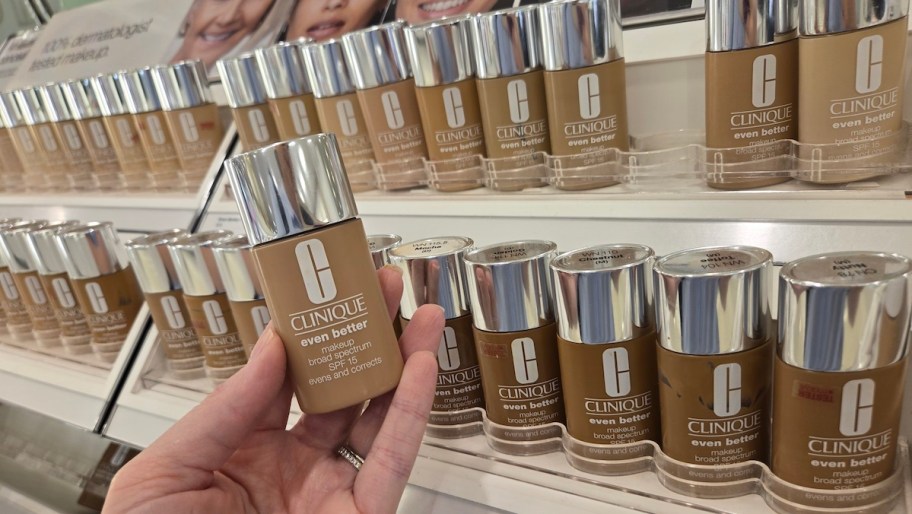hand holding Clinique Even Better Foundation bottle