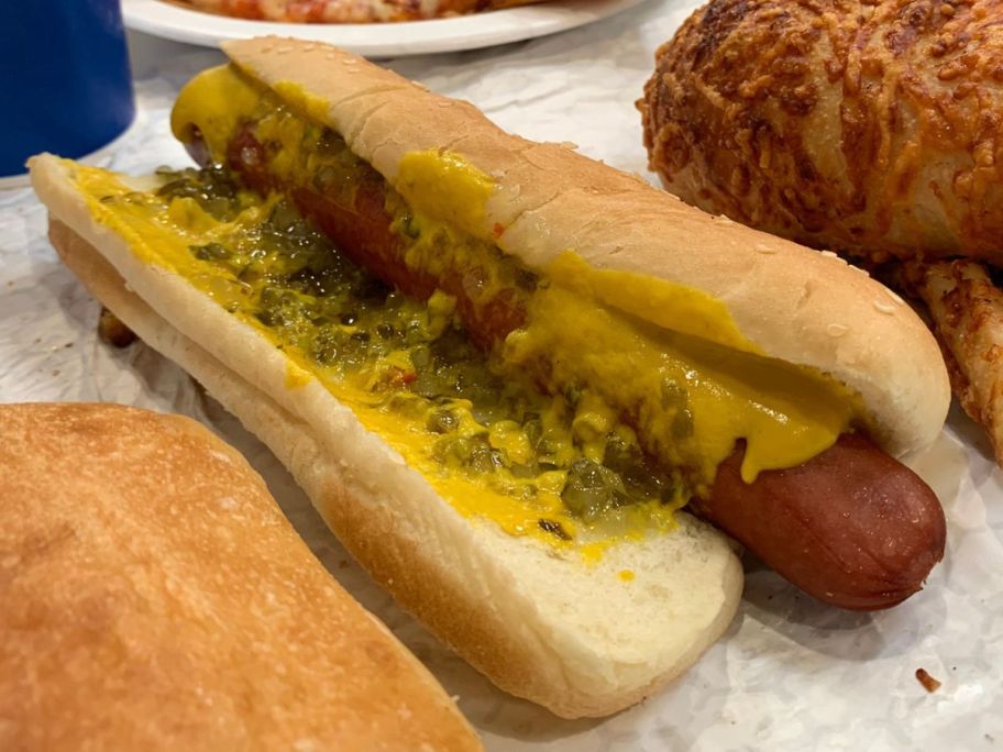 A Costco Hot Dog with mustard and relish on it