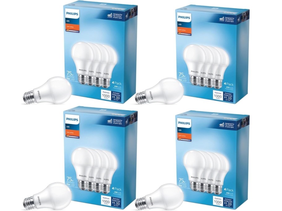 4 boxes of Philips 75 watt light bulbs with a single bulb in front of each