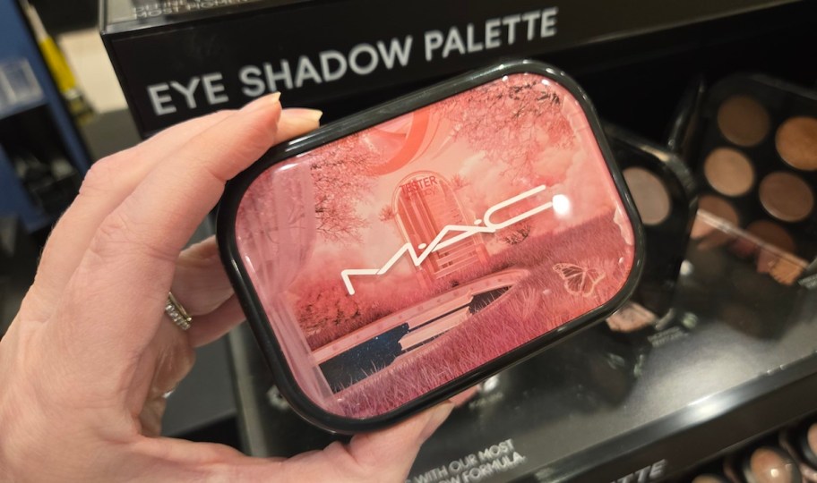 hand holding mac eyeshadow palette 