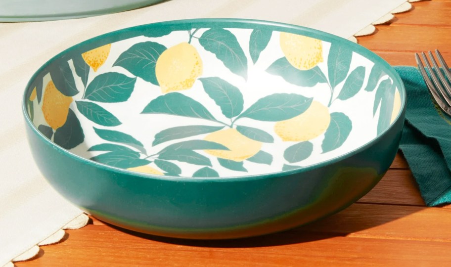green bowl with lemon print on the inside