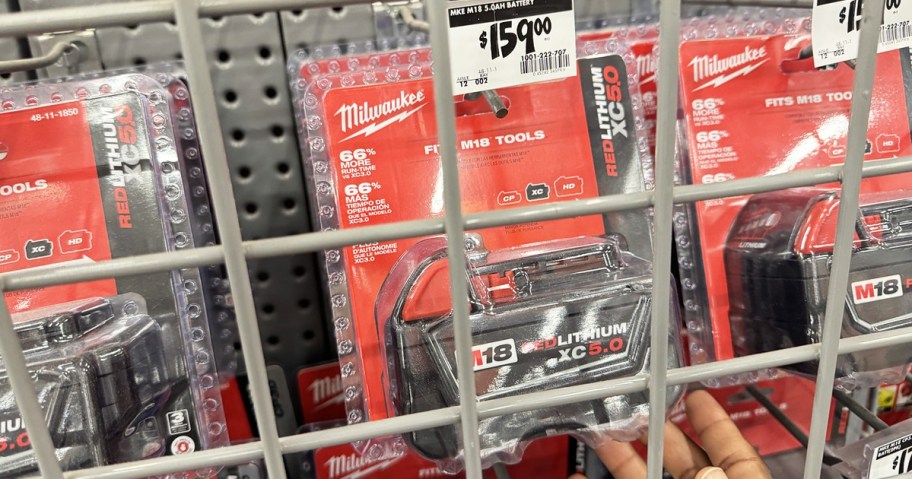hand touching package for a Milwaukee M18 Extended Capacity Battery