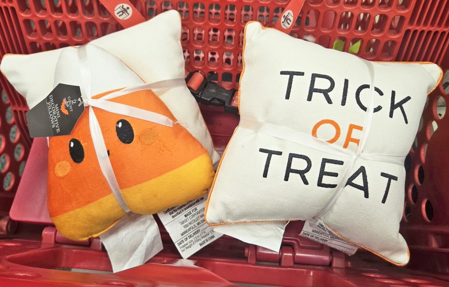 candy corn and trick or treat throw pillows in red shopping cart