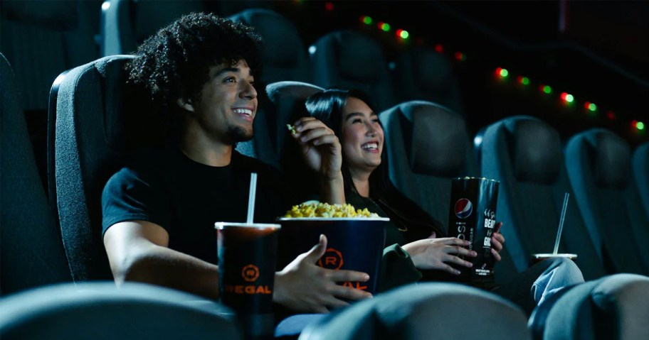 couple watching a movie in a theater 