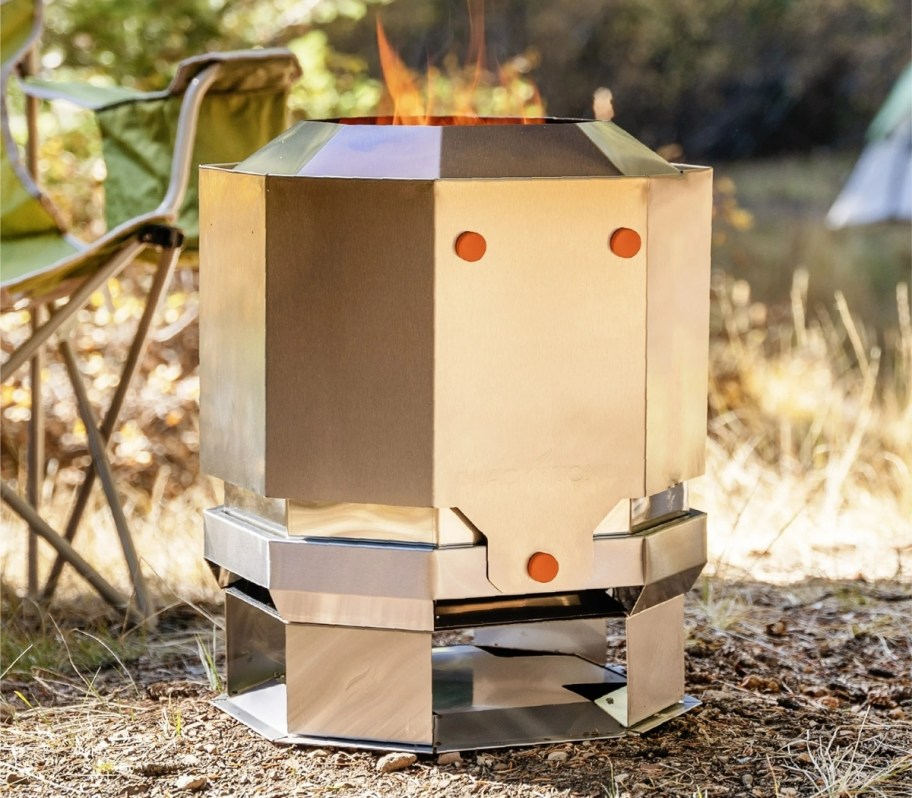 a silver metal smokeless fire pit