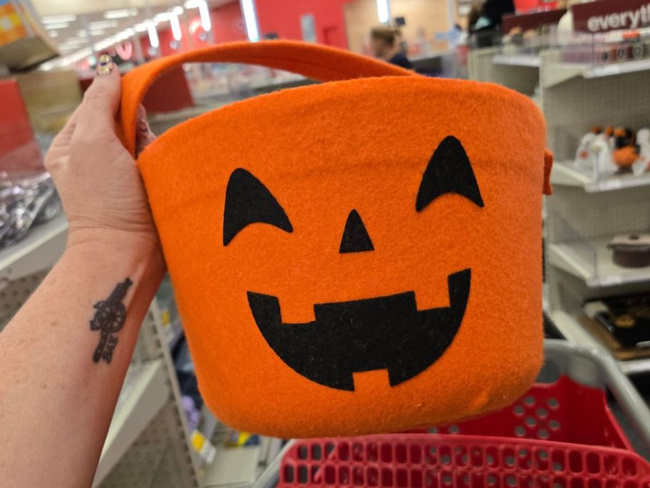 Trick or Treat Basket Pumpkin in hand in store