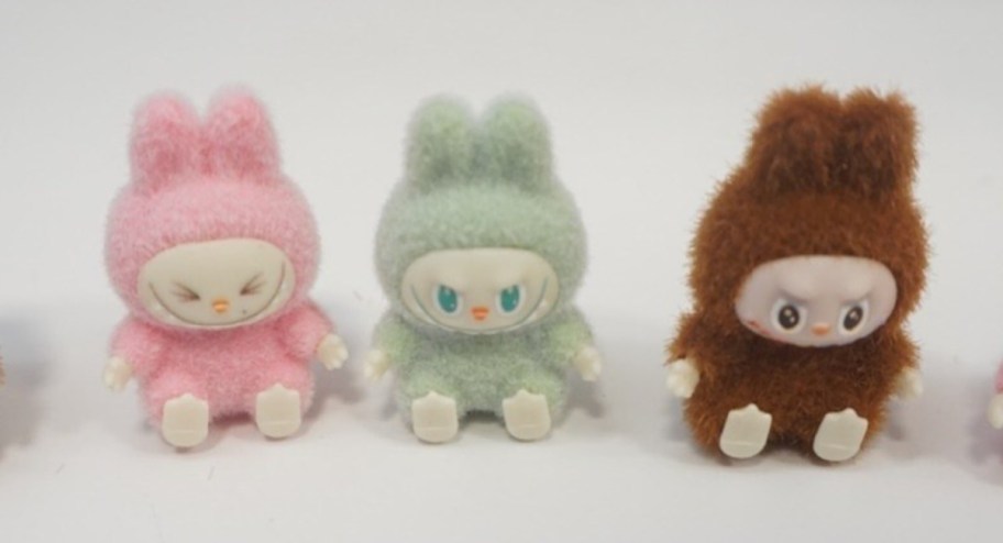 pink green and brown fake labubu dolls