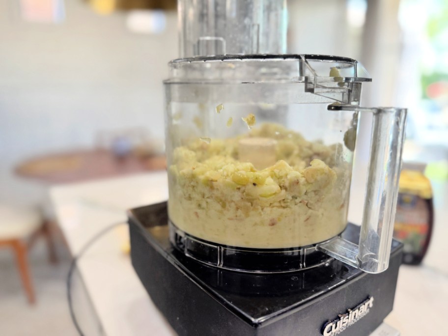 food processor on the counter making frozen grape sorbet 