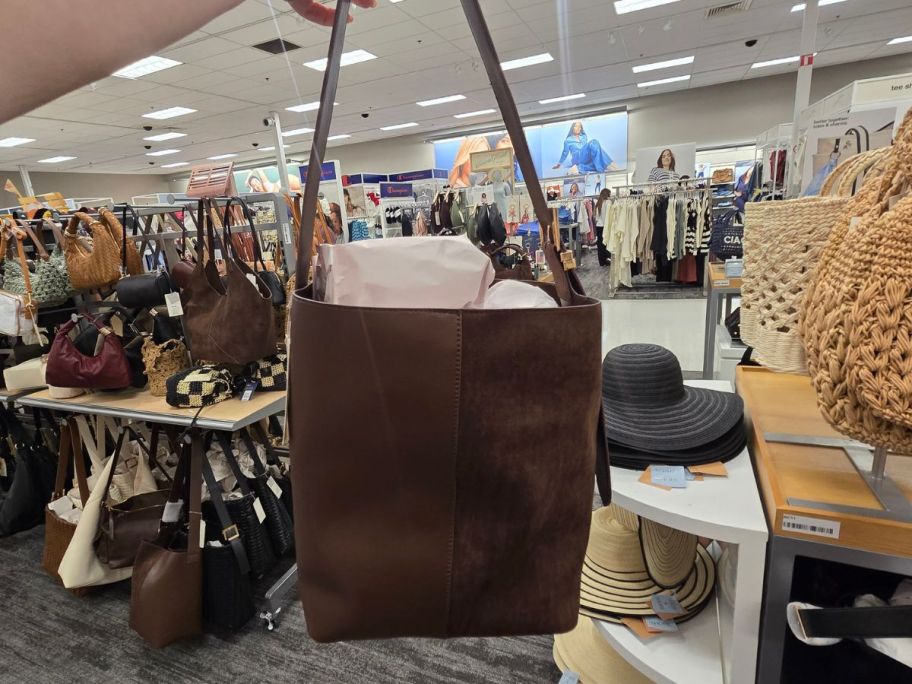 brown Shoulder Bucket Bag in hand in store