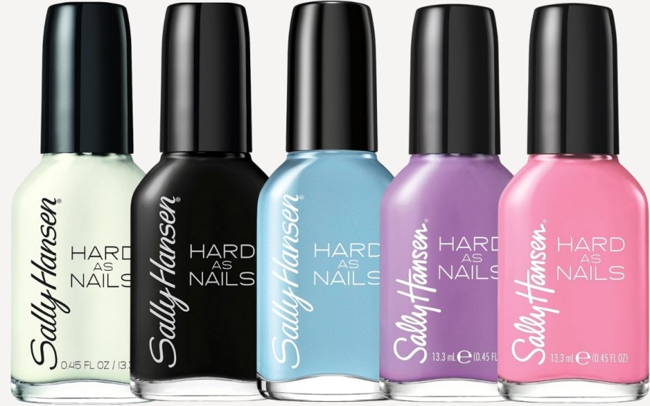 five bottles of sally hansen nail color in various shades