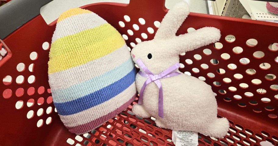 an egg and a bunny pillow in a Target cart