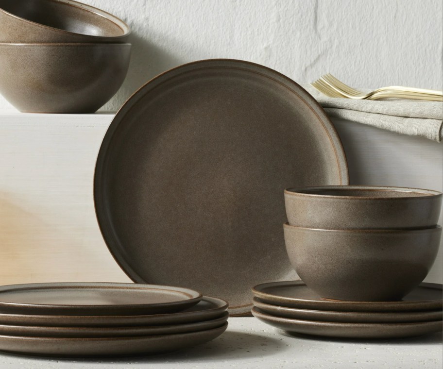 brown stoneware plates and bowls stacked