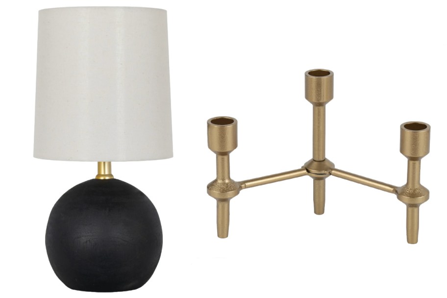 black ball lamp next to gold candleabra
