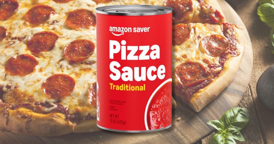 A can of pizza sauce in front of a pizza