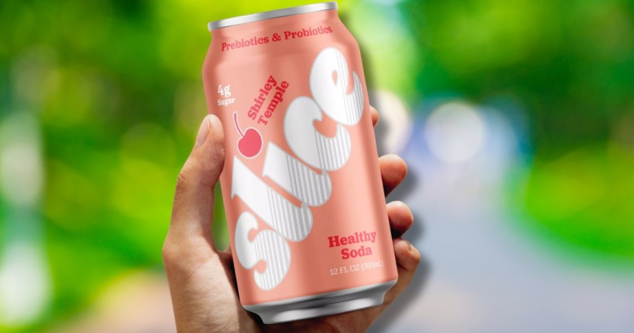 hand holding a can of Slice soda
