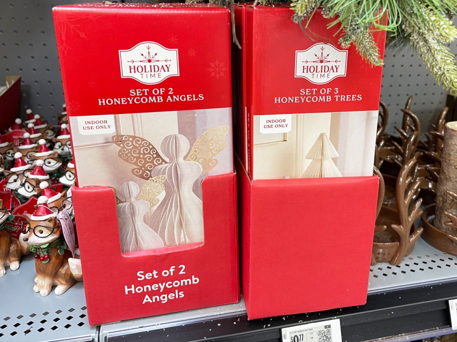 boxes of Holiday Time Honeycomb Paper Angels and Trees on store shelf