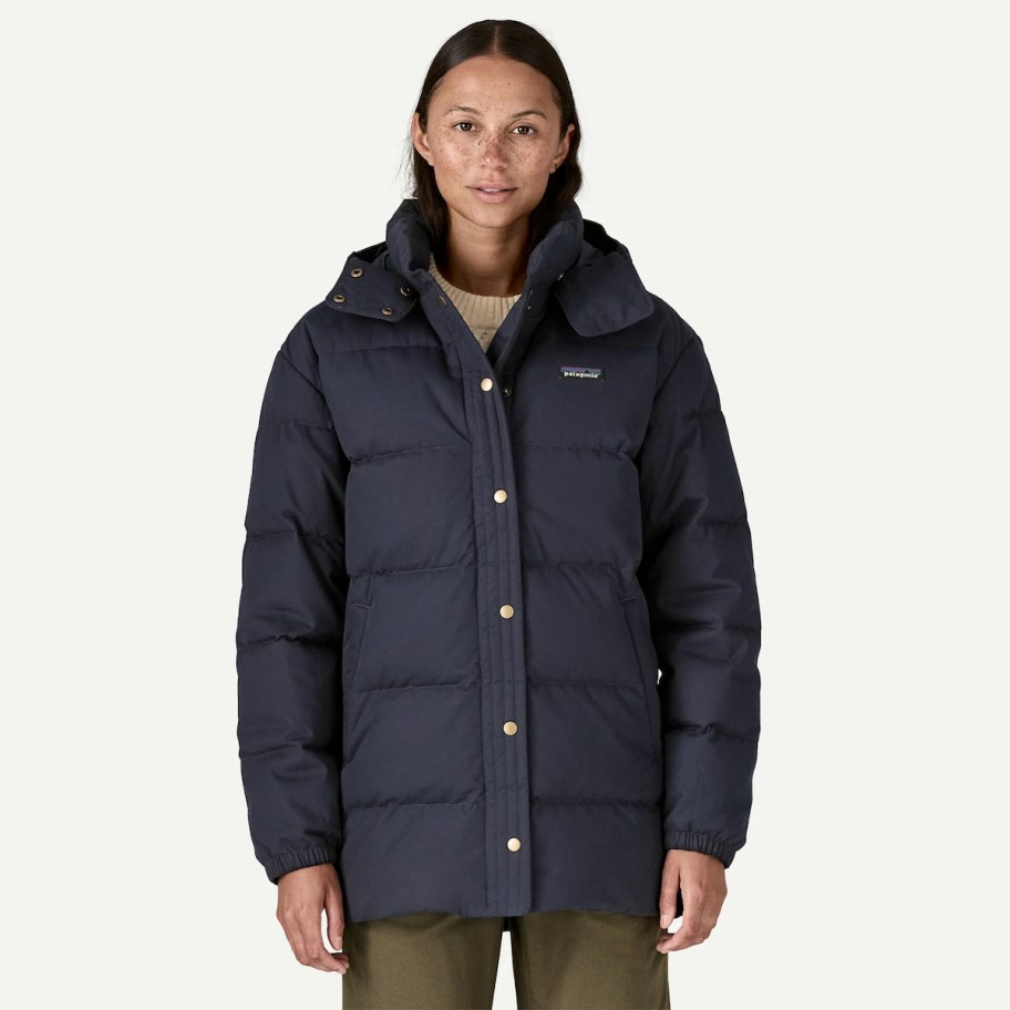 women wearing navy blue patagonia parka
