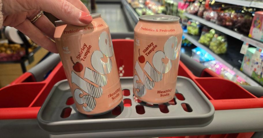 two pink Slice soda cans in a cart